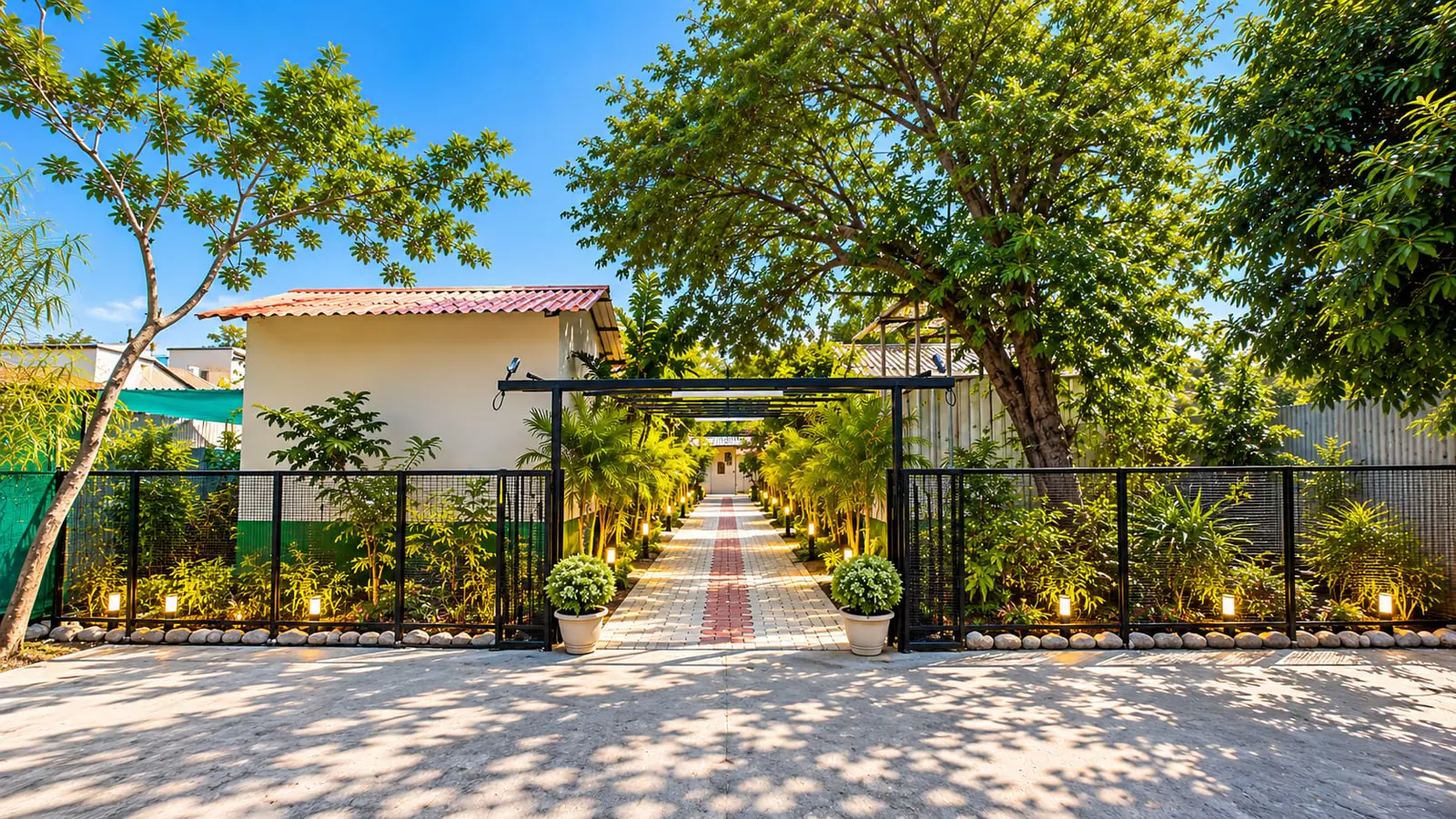 The garden entrance and walkway of SHA Stays in Rameshwaram